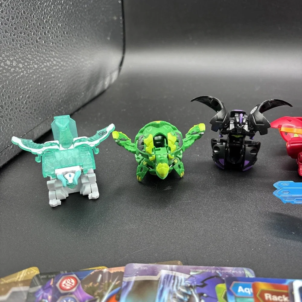Lot Of 9 Bakugan Figures And 23 Bakugan Cards/Metal Card
